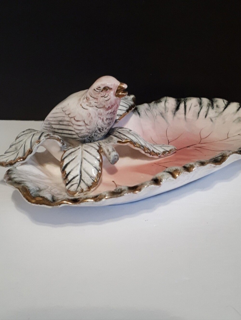 Beautiful Ucagco Vintage Leaf with bird pink, white, grey and 24k gold veined.